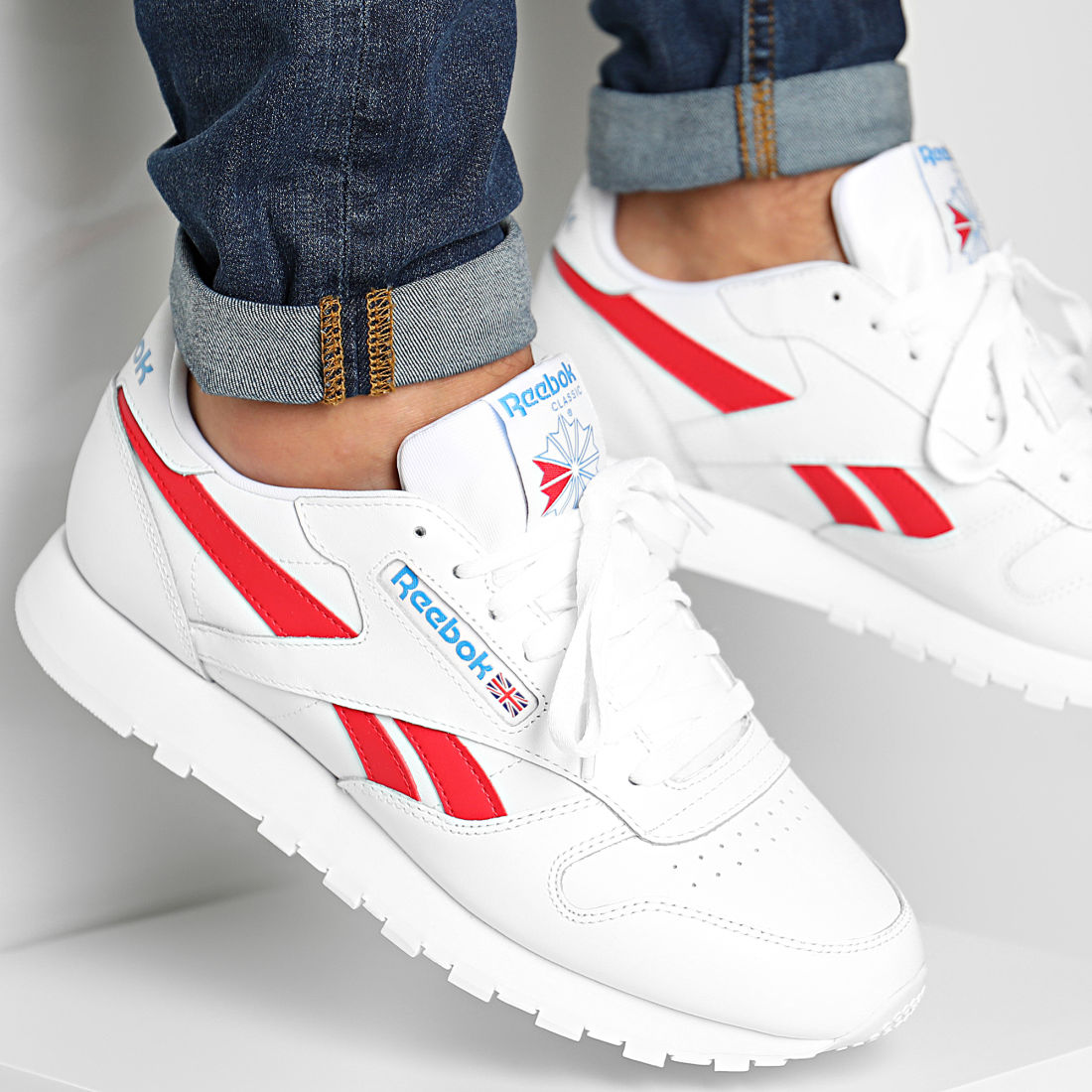 white and red reeboks