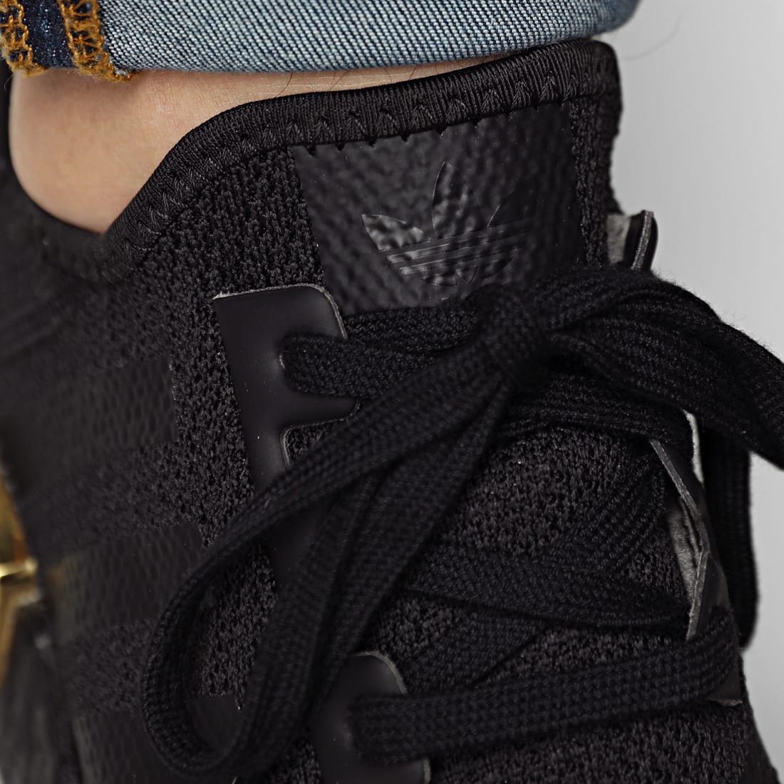 adidas NMD_R1 W (black / gold) | 43einhalb Sneaker Store