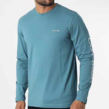  Calvin Klein - Tee Shirt Manches Longues Sleeve Placement Logo 9737 Bleu Clair