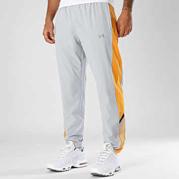 Under Armour - Pantalón de chándal UA Velociti Storm 6005899 Gris claro Naranja Rayas plateadas