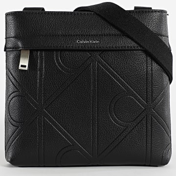 Calvin Klein - Bolsa Emblem Emboss Slim Flatpack D3370G Preto