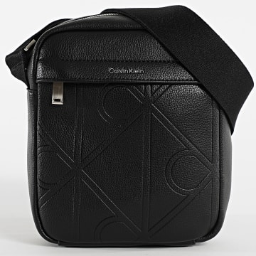 Calvin Klein - Bolsa Emblem Aop Emboss Reporter D3331G Preto