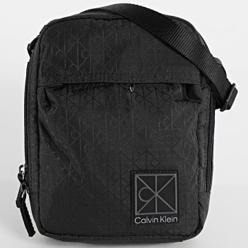 Calvin Klein - Bolsa Utility Emblem Reporter D3303G Preto