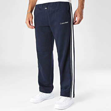 Calvin Klein - Calça de fato de treino com riscas Logo Tape Terry 601 Azul Marinho