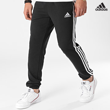 https://laboutiqueofficielle-res.cloudinary.com/image/upload/v1627638668/Desc/Watermark/adidas_performance.svg Adidas Performance - Pantalon Jogging A Bandes Essentials French Terry Tapered GK8829 Noir
