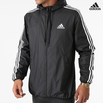 https://laboutiqueofficielle-res.cloudinary.com/image/upload/v1627638668/Desc/Watermark/adidas_performance.svg Adidas Sportswear - Coupe-Vent A Bandes GK9026 Noir