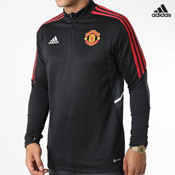 https://laboutiqueofficielle-res.cloudinary.com/image/upload/v1627638668/Desc/Watermark/adidas_performance.svg Adidas Performance - Tee Shirt Manches Longues A Bandes Manchester United H64013 Noir