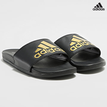 https://laboutiqueofficielle-res.cloudinary.com/image/upload/v1627638668/Desc/Watermark/adidas_performance.svg Adidas Sportswear - Claquettes Adilette Comfort GY1946 Noir Doré