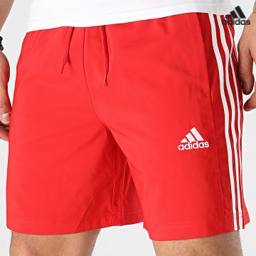 https://laboutiqueofficielle-res.cloudinary.com/image/upload/v1627638668/Desc/Watermark/adidas_performance.svg Adidas Sportswear - Short Jogging A Bandes IC1486 Rouge