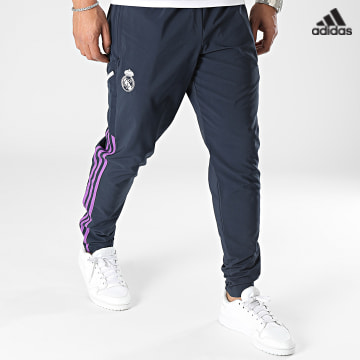 https://laboutiqueofficielle-res.cloudinary.com/image/upload/v1627638668/Desc/Watermark/adidas_performance.svg Adidas Sportswear - Pantalon Jogging A Bandes Real Madrid HT8807 Bleu Marine