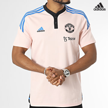 https://laboutiqueofficielle-res.cloudinary.com/image/upload/v1627638668/Desc/Watermark/adidas_performance.svg Adidas Sportswear - Polo Manches Courtes A Bandes Manchester United HT4286 Rose