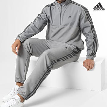 https://laboutiqueofficielle-res.cloudinary.com/image/upload/v1627638668/Desc/Watermark/adidas_performance.svg Adidas Sportswear - Ensemble De Survetement A Bandes IC6773 Gris