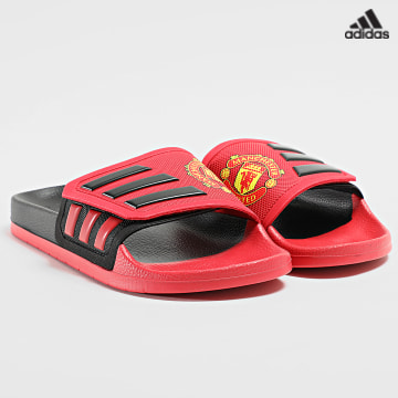 https://laboutiqueofficielle-res.cloudinary.com/image/upload/v1627638668/Desc/Watermark/adidas_performance.svg Adidas Sportswear - Claquettes Adilette GZ5940 Manchester United Noir Rouge