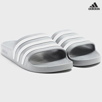 https://laboutiqueofficielle-res.cloudinary.com/image/upload/v1627638668/Desc/Watermark/adidas_performance.svg Adidas Sportswear - Claquettes Adilette Aqua F35538 Grey Three White