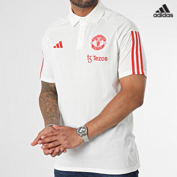 https://laboutiqueofficielle-res.cloudinary.com/image/upload/v1627638668/Desc/Watermark/adidas_performance.svg Adidas Sportswear - Polo Manches Courtes A bandes Manchester United IM0521 Blanc