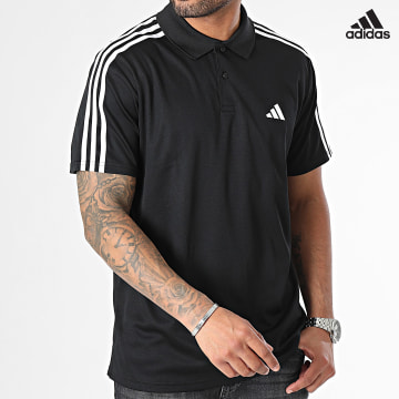 https://laboutiqueofficielle-res.cloudinary.com/image/upload/v1627638668/Desc/Watermark/adidas_performance.svg Adidas Sportswear - Polo Manches Courtes A Bandes IB8107 Noir