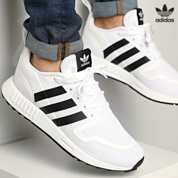 https://laboutiqueofficielle-res.cloudinary.com/image/upload/v1627646526/Desc/Watermark/3adidas_orginal.svg Adidas Originals - Baskets Multix FX5118 Footwear White Core Black