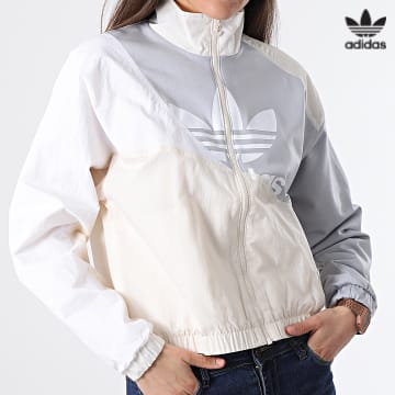 https://laboutiqueofficielle-res.cloudinary.com/image/upload/v1627646526/Desc/Watermark/3adidas_orginal.svg Adidas Originals - Veste Zippée Femme HC7054 Beige Gris