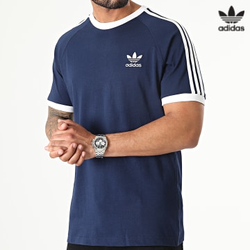https://laboutiqueofficielle-res.cloudinary.com/image/upload/v1627646526/Desc/Watermark/3adidas_orginal.svg Adidas Originals - Tee Shirt A Bandes HK7279 Bleu Marine
