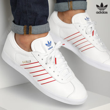 https://laboutiqueofficielle-res.cloudinary.com/image/upload/v1627646526/Desc/Watermark/3adidas_orginal.svg Adidas Originals - Baskets Gazelle GX9882 Footwear White Red Royal Blue