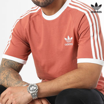 https://laboutiqueofficielle-res.cloudinary.com/image/upload/v1627646526/Desc/Watermark/3adidas_orginal.svg Adidas Originals - Tee Shirt A Bandes HK7276 Orange Foncé