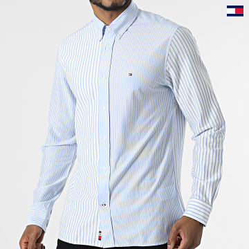 https://laboutiqueofficielle-res.cloudinary.com/image/upload/v1627647047/Desc/Watermark/5logo_tommyhilfiger_watermark.svg Tommy Hilfiger - Chemise A Manches Longues Knit Striped Blocking 5219 Blanc Bleu Clair