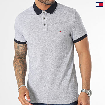 https://laboutiqueofficielle-res.cloudinary.com/image/upload/v1627647047/Desc/Watermark/5logo_tommyhilfiger_watermark.svg Tommy Hilfiger - Polo Manches Courtes Mouline Tipped 1665 Bleu Marine Chiné