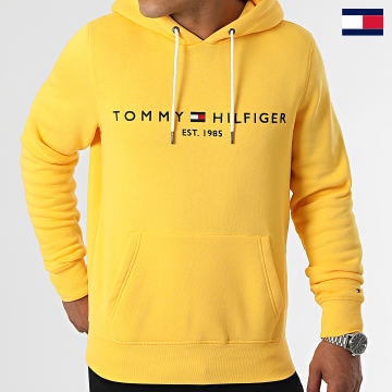 https://laboutiqueofficielle-res.cloudinary.com/image/upload/v1627647047/Desc/Watermark/7logo_tommy_hilfiger.svg Tommy Hilfiger - Sweat Capuche Tommy Logo 1599 Jaune