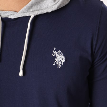 US Polo ASSN - Tee Shirt Manches Longues Capuche Logo Fleece Bleu Marine Gris Chiné
