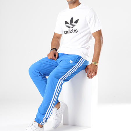 Adidas Originals - Pantalon Jogging Bandes Brodées Warm Up DH5765 Bleu Clair Blanc