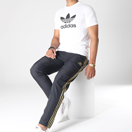 Adidas Sportswear - Pantalon Jogging A Bandes Real Madrid Wov DX7839 Noir Doré