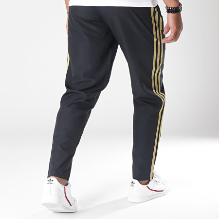 Adidas Sportswear - Pantalon Jogging A Bandes Real Madrid Wov DX7839 Noir Doré - LaBoutiqueOfficielle.com