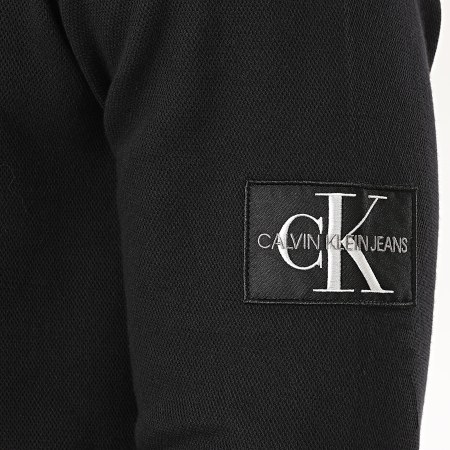 Calvin Klein - Tee Shirt Manches Longues Monogram Badge 5607 Noir