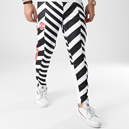 Adidas Sportswear - Pantalon Jogging A Bandes Manchester United FC AOP GK9435 Blanc Noir