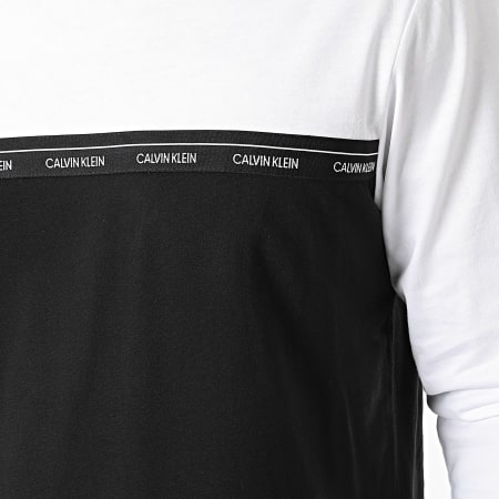 Calvin Klein - Tee Shirt Manches Longues Logo Stripe 7311 Noir Blanc