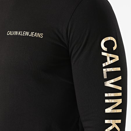 Calvin Klein - Tee Shirt Manches Longues Institutional 0547 Noir Doré