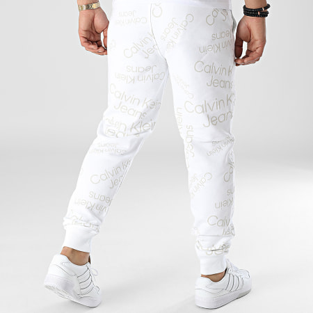 Calvin Klein Jeans - Pantalon Jogging Logo AOP 0586 Blanc Beige