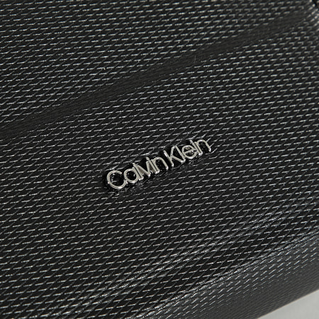 Calvin Klein - Sacoche Minimalism Reporter S 8999 Noir