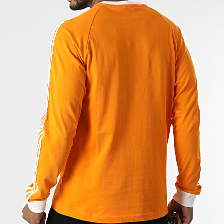 Adidas Originals - Maglietta a maniche lunghe a 3 strisce HE9531 Arancione