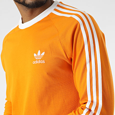 Adidas Originals - Tee Shirt Manches Longues A Bandes 3 Stripes HE9531 Orange