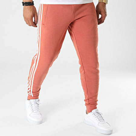 Adidas Originals - HK7300 Pantalón de chándal de 3 rayas rojo ladrillo