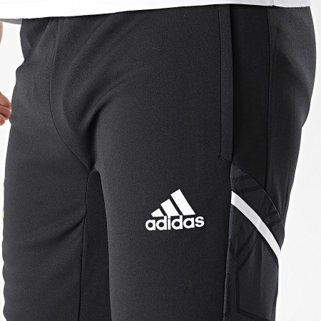 Adidas Sportswear - Pantaloni da jogging con bande nere del Manchester United FC HG3986