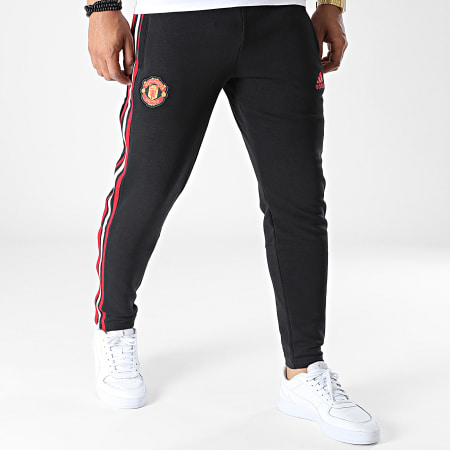 Adidas Sportswear - Pantaloni da jogging a fascia del Manchester United HU1184 Nero