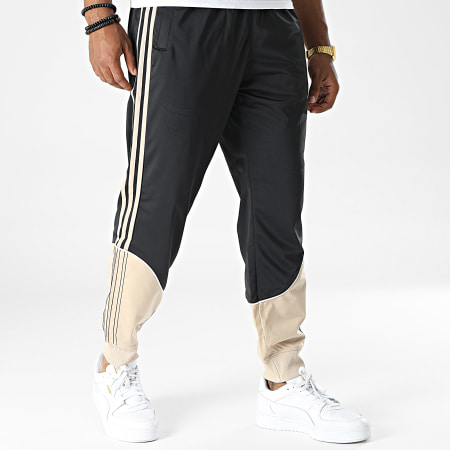 Adidas Originals - SST HI3004 Pantalón de chándal de punto a rayas negro beige