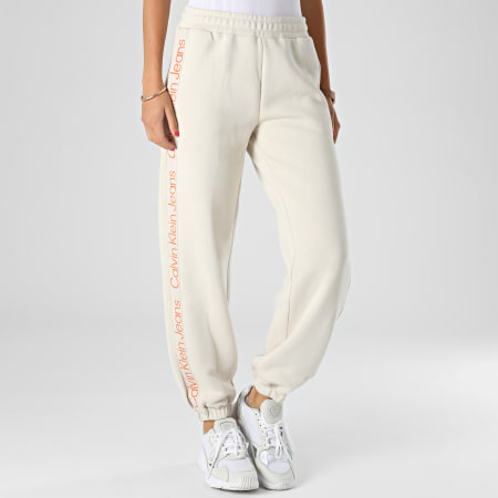 Calvin Klein - Pantalon Jogging Femme A Bandes Logo Tape 9738 Beige