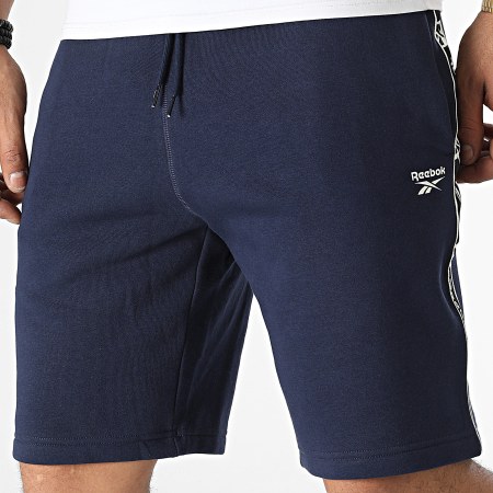 Reebok - HJ7842 Pantalones cortos de jogging con banda azul marino