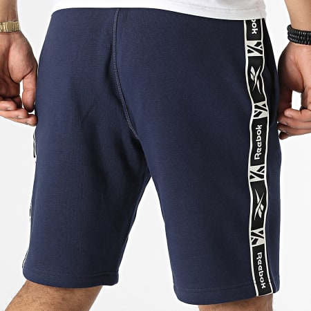 Reebok - HJ7842 Pantalones cortos de jogging con banda azul marino