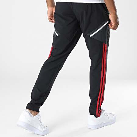 Adidas Sportswear - Pantaloni da jogging a banda nera H64029 del Manchester United