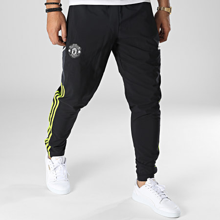Adidas Sportswear - Pantaloni da jogging con bande nere del Manchester United FC HE6681