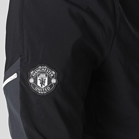 Adidas Sportswear - Pantaloni da jogging con bande nere del Manchester United FC HE6681